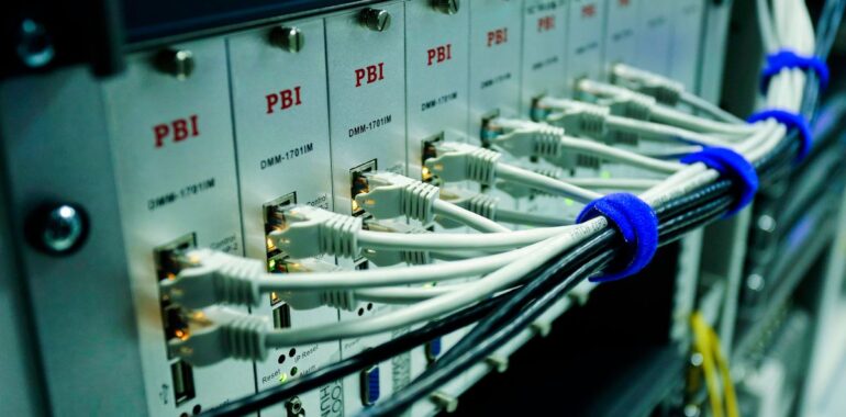 Close-up of network cables plugged into a switch in a server room